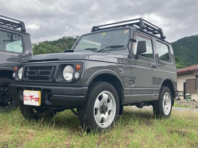 ジムニー ワイルドウインド　４ＷＤ　５速マニュアル　ＣＤオーディオ　エアコン　走行距離１６１６４２キロ　車検整備付き　修復歴無し　保証付き　車体色／グレー（2枚目）