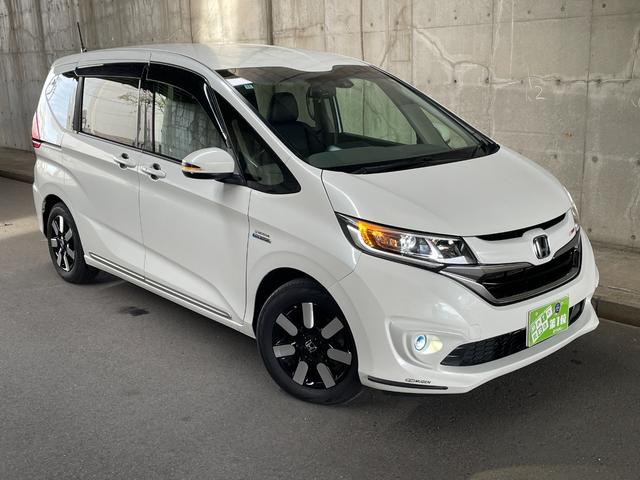 フリードハイブリッド ハイブリッド・EX ワンオーナー 両側パワスラ 純正15インチAW 純正ナビ フルセグTV バックカメラ 前後ドラレコ ETC スマートキープッシュスタート LEDヘッドライト ハーフレザーシート 禁煙車 ユーザー買取車(2枚目)