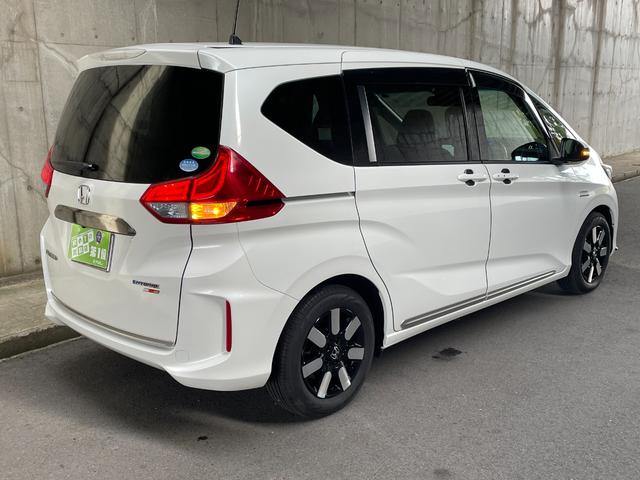 フリードハイブリッド ハイブリッド・EX ワンオーナー 両側パワスラ 純正15インチAW 純正ナビ フルセグTV バックカメラ 前後ドラレコ ETC スマートキープッシュスタート LEDヘッドライト ハーフレザーシート 禁煙車 ユーザー買取車(3枚目)