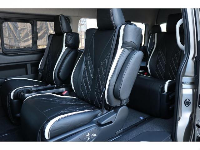 ハイエースワゴン グランドキャビン ファインテックツアラー ベージュ ファインテックツアラー キャプテンシート4脚 オリジナルフロントスポイラー ローダウン BIGXナビ フリップダウン ETC シートカバー ベットキット バルベロ17インチ ナスカータイヤ(5枚目)