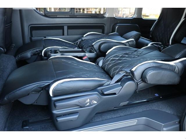 ハイエースワゴン グランドキャビン ファインテックツアラー ベージュ ファインテックツアラー キャプテンシート4脚 オリジナルフロントスポイラー ローダウン BIGXナビ フリップダウン ETC シートカバー ベットキット バルベロ17インチ ナスカータイヤ(9枚目)