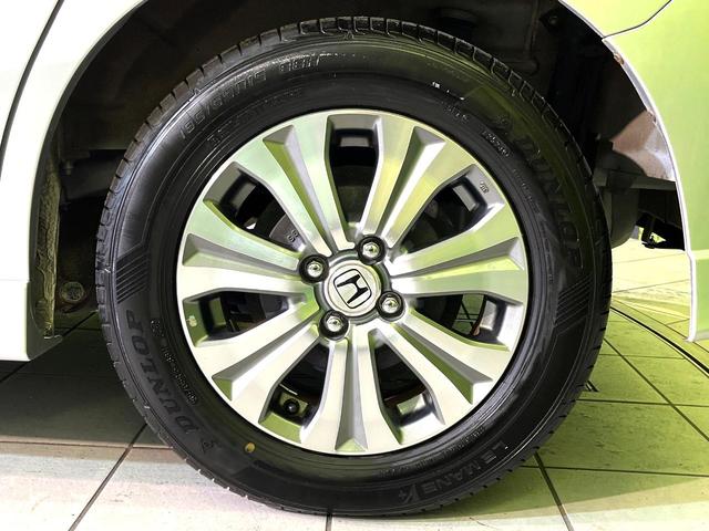 フリードスパイクハイブリッド ジャストセレクション 両側電動ドア SDナビ バックカメラ 禁煙車 ハーフレザーシート ドラレコ スマートキー HIDヘッド ETC クルコン オートエアコン 純正15インチアルミ 地デジ 横滑り防止装置(57枚目)