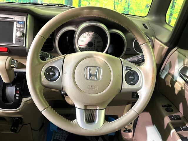 N-BOX G・ターボパッケージ ターボ 純正ナビ バックカメラ 両側電動スライド クルコン ETC HIDヘッド オートライト オートエアコン スマートキー プッシュスタート 革巻きステアリング パドルシフト アイドリングストップ(11枚目)