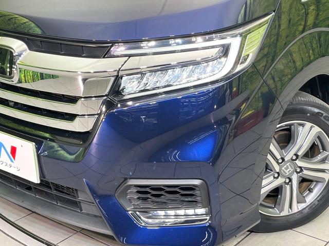 ステップワゴンスパーダ スパーダハイブリッド G・EX ホンダセンシング 禁煙車 後期型 純正9型ナビ 全周囲カメラ フルセグ CD/DVD Bluetooth接続 純正フリップダウンモニター 衝突軽減装置 オートハイビーム 両側電動スライドドア 後席オートエアコン ETC(13枚目)