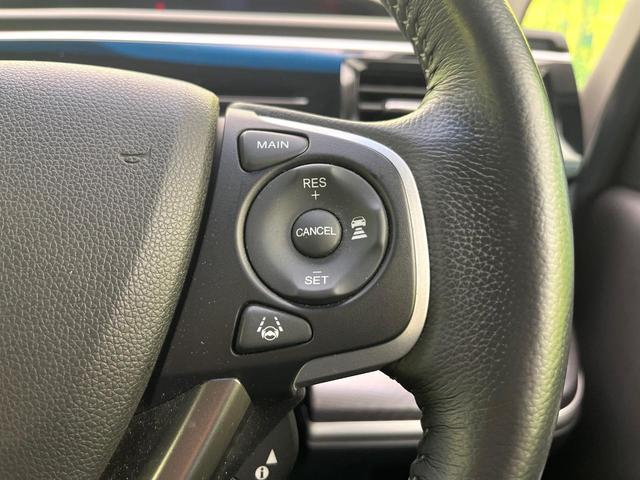 ステップワゴンスパーダ スパーダハイブリッド G・EX ホンダセンシング 禁煙車 後期型 純正9型ナビ 全周囲カメラ フルセグ CD/DVD Bluetooth接続 純正フリップダウンモニター 衝突軽減装置 オートハイビーム 両側電動スライドドア 後席オートエアコン ETC(32枚目)