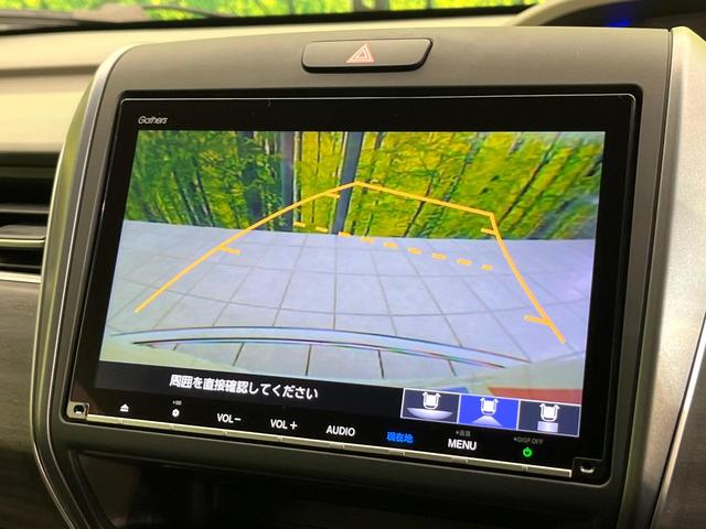 フリードハイブリッド ハイブリッド・Ｇ　禁煙車　純正９型ナビ　バックカメラ　Ｂｌｕｅｔｏｏｔｈ　ＣＤ／ＤＶＤ再生　純正フリップダウンモニター　衝突軽減装置　アダプティブクルコン　ＬＥＤヘッドライト　両側電動スライドドア　前席シートヒーター（4枚目）