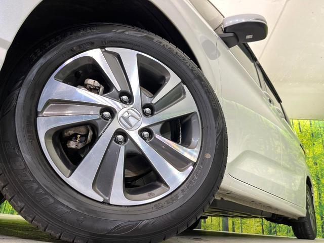 フリードハイブリッド ハイブリッド・Ｇ　禁煙車　純正９型ナビ　バックカメラ　Ｂｌｕｅｔｏｏｔｈ　ＣＤ／ＤＶＤ再生　純正フリップダウンモニター　衝突軽減装置　アダプティブクルコン　ＬＥＤヘッドライト　両側電動スライドドア　前席シートヒーター（14枚目）