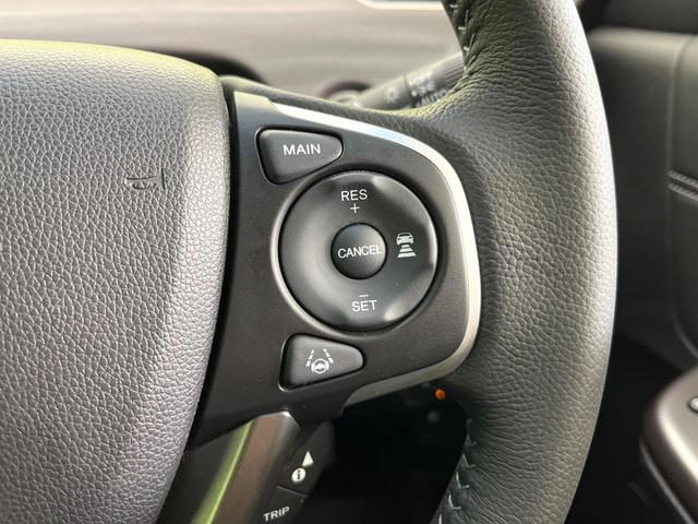 フリードハイブリッド ハイブリッド・Ｇ　禁煙車　純正９型ナビ　バックカメラ　Ｂｌｕｅｔｏｏｔｈ　ＣＤ／ＤＶＤ再生　純正フリップダウンモニター　衝突軽減装置　アダプティブクルコン　ＬＥＤヘッドライト　両側電動スライドドア　前席シートヒーター（29枚目）