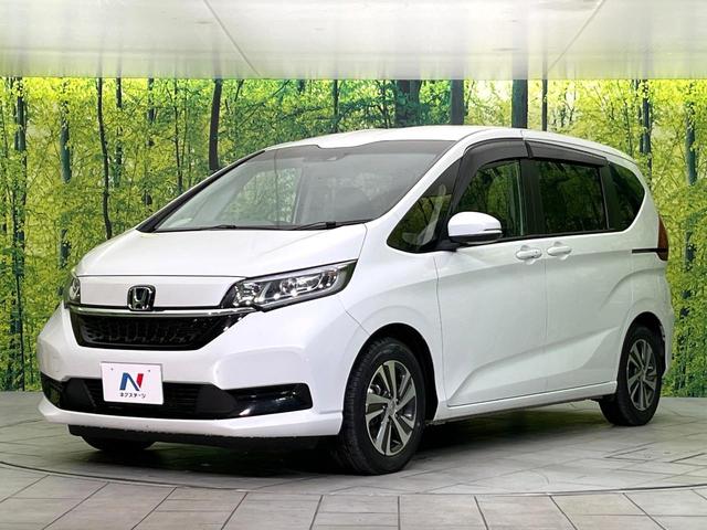 フリードハイブリッド ハイブリッド・Ｇ　禁煙車　純正９型ナビ　バックカメラ　Ｂｌｕｅｔｏｏｔｈ　ＣＤ／ＤＶＤ再生　純正フリップダウンモニター　衝突軽減装置　アダプティブクルコン　ＬＥＤヘッドライト　両側電動スライドドア　前席シートヒーター（61枚目）