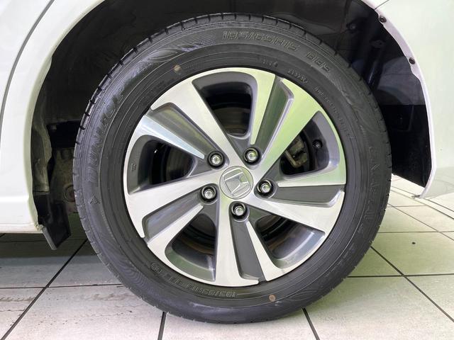 フリードハイブリッド ハイブリッド・Ｇ　禁煙車　純正９型ナビ　バックカメラ　Ｂｌｕｅｔｏｏｔｈ　ＣＤ／ＤＶＤ再生　純正フリップダウンモニター　衝突軽減装置　アダプティブクルコン　ＬＥＤヘッドライト　両側電動スライドドア　前席シートヒーター（65枚目）