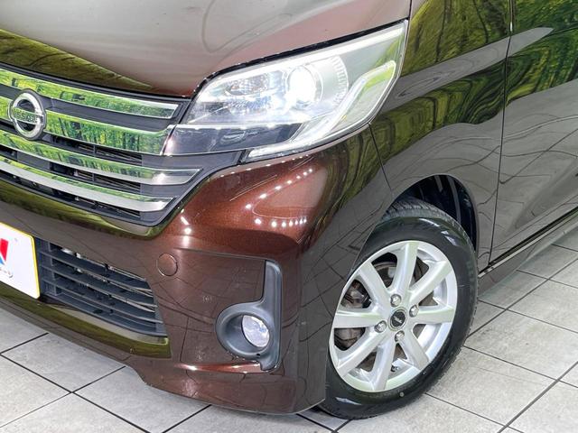 デイズルークス ハイウェイスター X Gパッケージ 4WD 禁煙車 純正ナビ 全周囲カメラ CD/DVD/フルセグ Bluetooth接続 純正フリップダウンモニター HIDヘッドライト 両側電動スライドドア 革巻きステアリング 後席ロールサンシェード(12枚目)