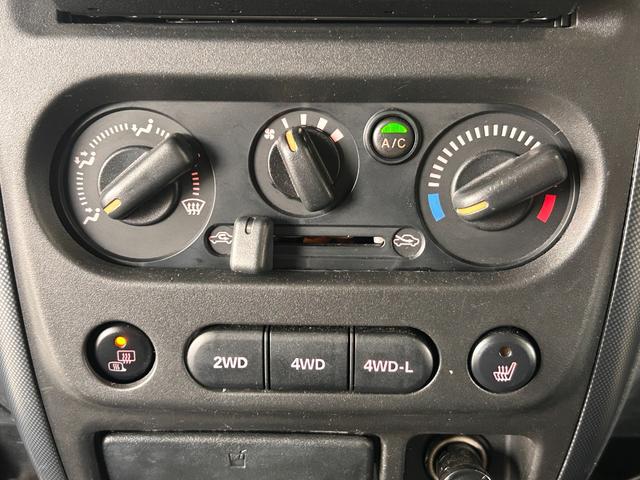 ジムニー ワイルドウインド　ＡＵＸ接続　エアコンパワステ　四駆　シートヒーター付き　メモリーナビゲーション　パワーウインドウ　ナビ・ＴＶ　エアバック　キーレス付き　ＥＴＣ車載器　フルセグテレビ　衝突安全ボディ　ダブルエアバック（45枚目）