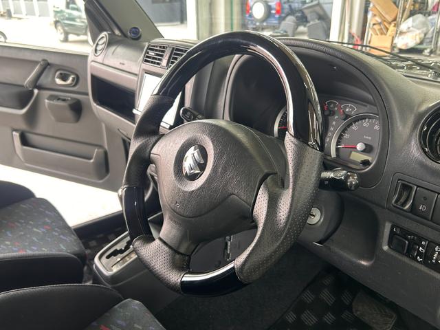 ジムニー ワイルドウインド　ＡＵＸ接続　エアコンパワステ　四駆　シートヒーター付き　メモリーナビゲーション　パワーウインドウ　ナビ・ＴＶ　エアバック　キーレス付き　ＥＴＣ車載器　フルセグテレビ　衝突安全ボディ　ダブルエアバック（56枚目）