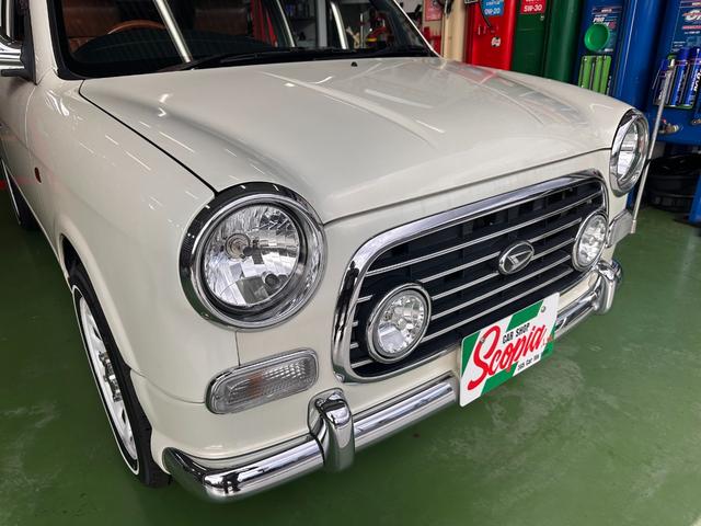 ミラジーノ ミニライトスペシャル　オルタネータ交換（Ｒ７年１１月）　新品ホワイトリボンタイヤ　新品ブラウンシートカバー　ＮＡＲＤＩステアリング＆シフトノブ　ホワイトホイール　新品フロアマット　純正ホワイトカラー　ＵＳＢ接続オーディオ（5枚目）