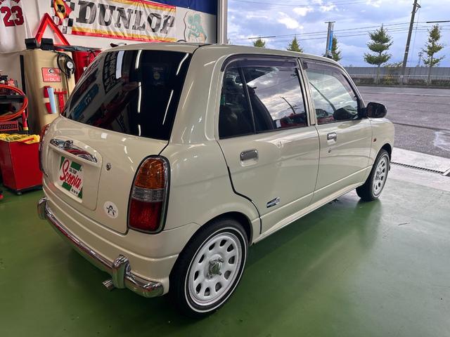 ミラジーノ ミニライトスペシャル　オルタネータ交換（Ｒ７年１１月）　新品ホワイトリボンタイヤ　新品ブラウンシートカバー　ＮＡＲＤＩステアリング＆シフトノブ　ホワイトホイール　新品フロアマット　純正ホワイトカラー　ＵＳＢ接続オーディオ（10枚目）