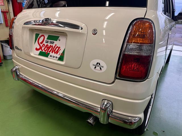 ミラジーノ ミニライトスペシャル　オルタネータ交換（Ｒ７年１１月）　新品ホワイトリボンタイヤ　新品ブラウンシートカバー　ＮＡＲＤＩステアリング＆シフトノブ　ホワイトホイール　新品フロアマット　純正ホワイトカラー　ＵＳＢ接続オーディオ（12枚目）