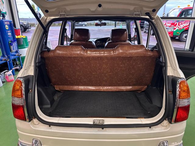 ミラジーノ ミニライトスペシャル　オルタネータ交換（Ｒ７年１１月）　新品ホワイトリボンタイヤ　新品ブラウンシートカバー　ＮＡＲＤＩステアリング＆シフトノブ　ホワイトホイール　新品フロアマット　純正ホワイトカラー　ＵＳＢ接続オーディオ（57枚目）