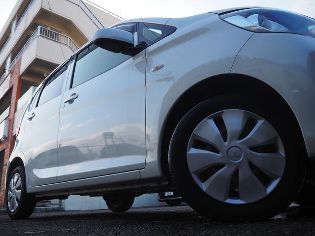 ｅＫワゴン Ｅ　クラリオンＳＤナビ　地デジ　ＢＴ接続　純正ホイールキャップ　キーレス　シートヒーター　ヘッドライトレベライザー　ベンチシート　電格ミラー　エアコン　ドアバイザー　フロアマット　ハロゲンヘッドライト（11枚目）