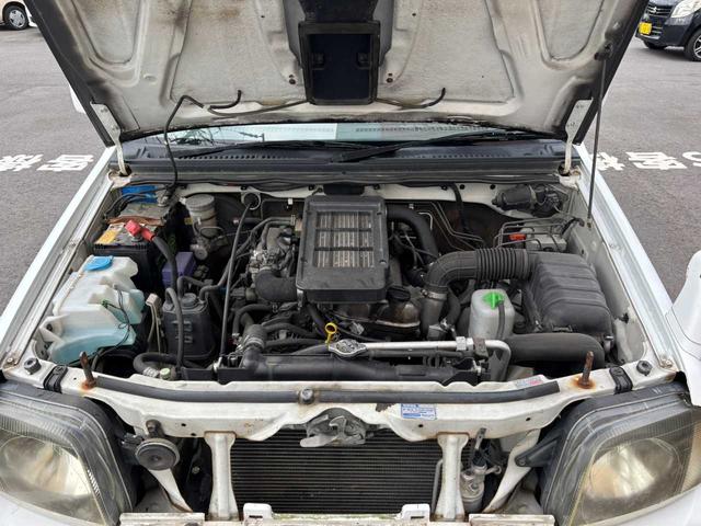 ジムニー XG 5MT エアコン 普通車登録(オーバーフェンダー) リフトアップ FRPボンネット 社外15インチアルミホイール ETC(22枚目)