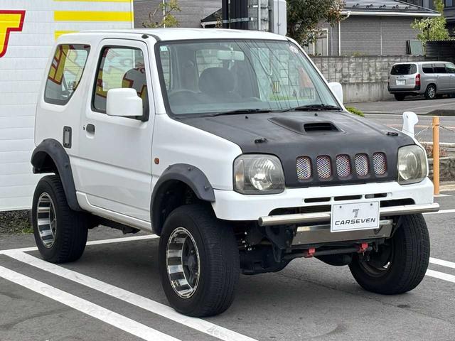 ジムニー XG 5MT エアコン 普通車登録(オーバーフェンダー) リフトアップ FRPボンネット 社外15インチアルミホイール ETC(35枚目)
