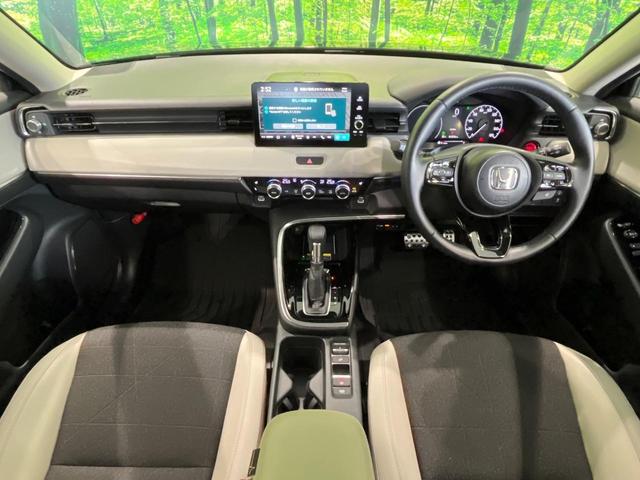 ヴェゼル ｅ：ＨＥＶ　Ｚ　４ＷＤ　純正ナビ　寒冷地仕様　バックカメラ　Ｂｌｕｅｔｏｏｔｈ　ＥＴＣ　ドラレコ　パワーバックドア　ブラインドスポットモニター　シートヒーター　ＬＥＤヘッド　革巻きステアリング　プッシュスタート（2枚目）
