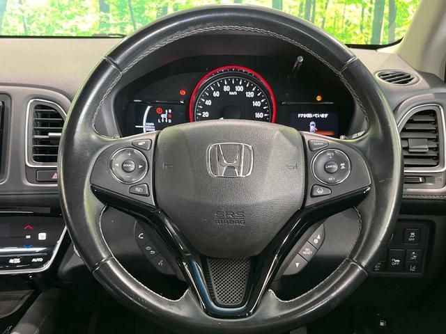 ヴェゼル ハイブリッドＺ・ホンダセンシング　４ＷＤ　純正ナビ　バックカメラ　衝突軽減　アダプティブクルーズ　ＥＴＣ　Ｂｌｕｅｔｏｏｔｈ　フルセグ　シートヒーター　ＬＥＤヘッド・フォグ　デュアルオートエアコン　オートライト　革巻きステアリング（11枚目）
