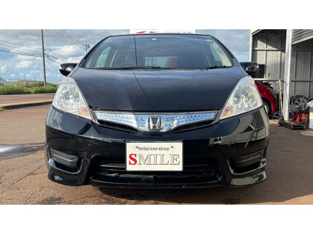 フィットシャトルハイブリッド ハイブリッド 検9年1月 キーレスキー エアコン ESC 運転席助手席エアバック パワーステアリング クルコン ABS イモビライザー 衝突安全ボディ 電動格納ミラー ETC SDナビ DVD視聴 ワンセグ(2枚目)