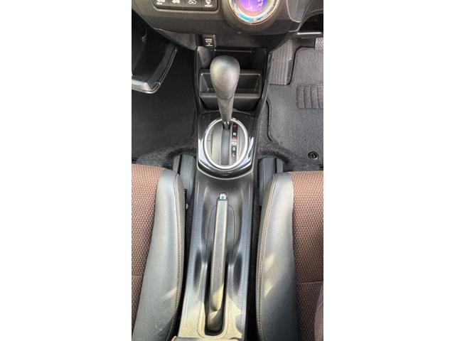 フィットシャトルハイブリッド ハイブリッド 検9年1月 キーレスキー エアコン ESC 運転席助手席エアバック パワーステアリング クルコン ABS イモビライザー 衝突安全ボディ 電動格納ミラー ETC SDナビ DVD視聴 ワンセグ(19枚目)