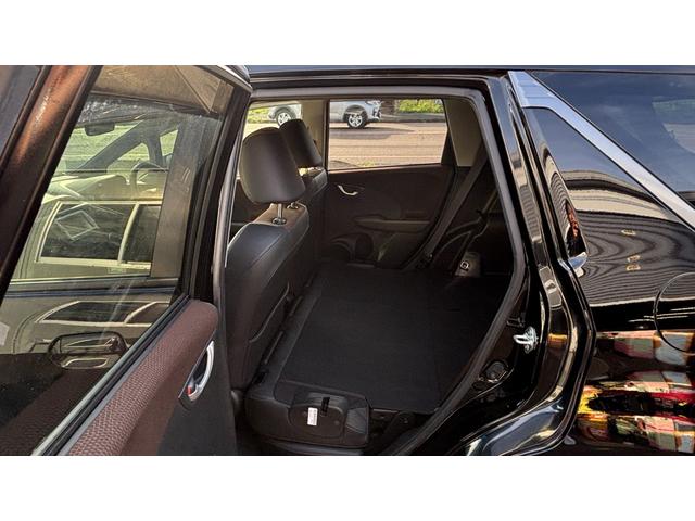 フィットシャトルハイブリッド ハイブリッド 検9年1月 キーレスキー エアコン ESC 運転席助手席エアバック パワーステアリング クルコン ABS イモビライザー 衝突安全ボディ 電動格納ミラー ETC SDナビ DVD視聴 ワンセグ(27枚目)