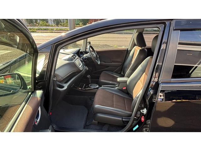 フィットシャトルハイブリッド ハイブリッド 検9年1月 キーレスキー エアコン ESC 運転席助手席エアバック パワーステアリング クルコン ABS イモビライザー 衝突安全ボディ 電動格納ミラー ETC SDナビ DVD視聴 ワンセグ(30枚目)