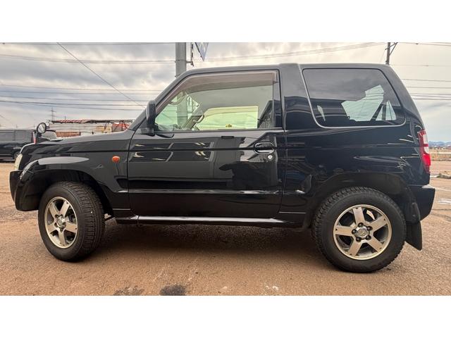 パジェロミニ ＶＲ　車検整備２年付　ＡＣ　パワーウインドー　キーレスエントリーキー　ＳＲＳ　切り替え４ＷＤ　助手席エアバック　ワンセグ　ＰＳ　電動格納ミラー　盗難防止装置　ＡＢＳ　衝突安全ボディ　ナビ・ＴＶ（8枚目）