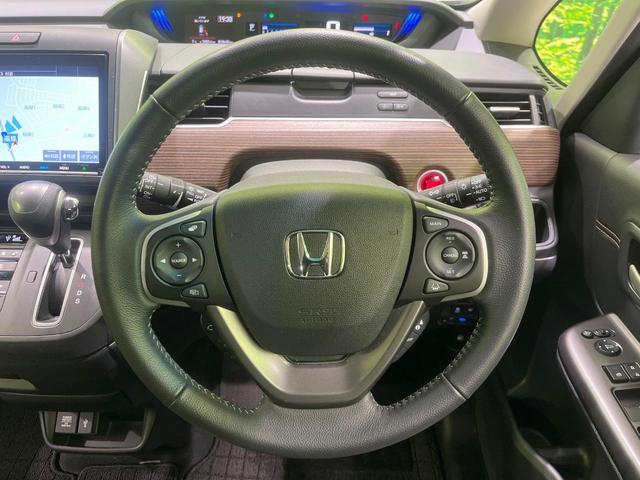 フリード クロスター　４ＷＤ　両側電動スライドドア　純正９型ＳＤナビ　バックカメラ　ホンダセンシング　禁煙車　スマートキー　ＬＥＤヘッド　ビルトインＥＴＣ　クルコン　純正１５インチアルミ　車線逸脱警報　オートライト（11枚目）