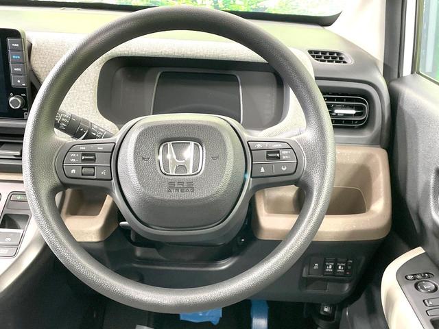 フリード エアー 登録済未使用車 両側電動ドア 純正9型ナビ バックカメラ 衝突被害軽減システム レーダークルーズ コーナーセンサー スマートキー LEDヘッド オートハイビーム 車線逸脱警報 オートライト(12枚目)