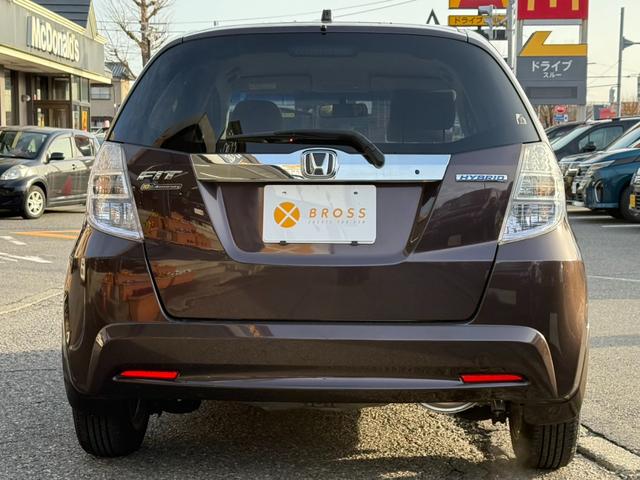 フィットハイブリッド ハイブリッド・10thアニバーサリー 10周年記念車 東海仕入 ナビTV Bluetooth スマートキー ディスチャージヘッドライト クルコン 純正アルミ(6枚目)