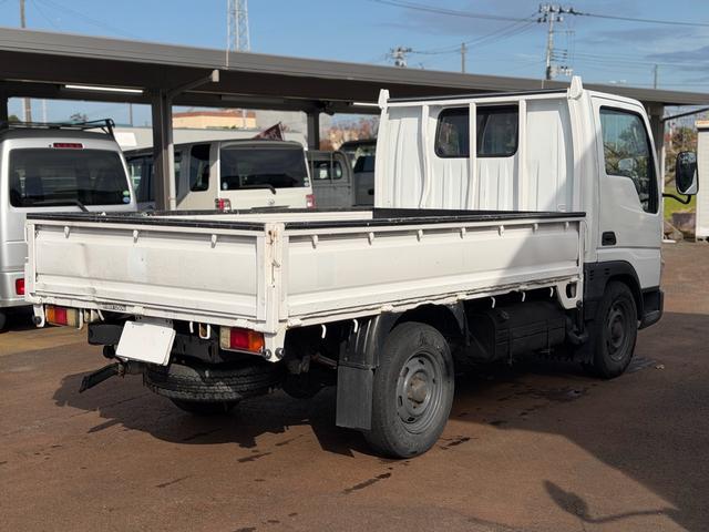 タイタンダッシュ シングルワイドローＤＸ　車検Ｒ８年４月まで　切り替え４ＷＤ　ＭＴ　純正オーディオ　電動格納ミラー　エアコン　パワーステアリング　ＨＩＤヘッドライト　ＥＴＣ車載器　シングルタイヤ　新免許対応車（2枚目）