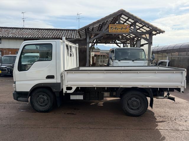 タイタンダッシュ シングルワイドローＤＸ　車検Ｒ８年４月まで　切り替え４ＷＤ　ＭＴ　純正オーディオ　電動格納ミラー　エアコン　パワーステアリング　ＨＩＤヘッドライト　ＥＴＣ車載器　シングルタイヤ　新免許対応車（7枚目）