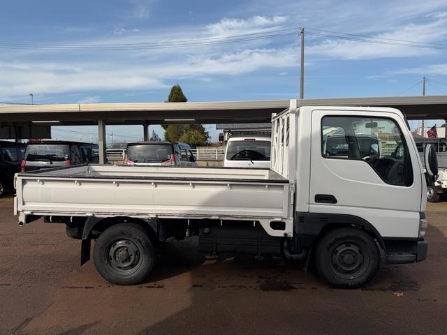 タイタンダッシュ シングルワイドローＤＸ　車検Ｒ８年４月まで　切り替え４ＷＤ　ＭＴ　純正オーディオ　電動格納ミラー　エアコン　パワーステアリング　ＨＩＤヘッドライト　ＥＴＣ車載器　シングルタイヤ　新免許対応車（8枚目）