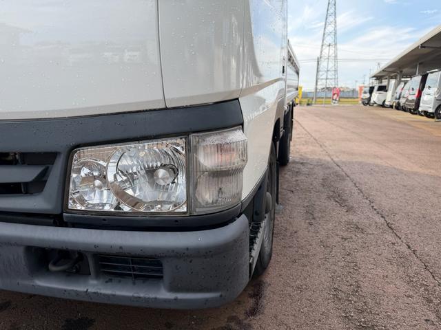 タイタンダッシュ シングルワイドローＤＸ　車検Ｒ８年４月まで　切り替え４ＷＤ　ＭＴ　純正オーディオ　電動格納ミラー　エアコン　パワーステアリング　ＨＩＤヘッドライト　ＥＴＣ車載器　シングルタイヤ　新免許対応車（9枚目）