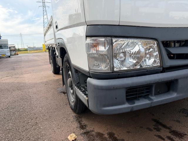 タイタンダッシュ シングルワイドローＤＸ　車検Ｒ８年４月まで　切り替え４ＷＤ　ＭＴ　純正オーディオ　電動格納ミラー　エアコン　パワーステアリング　ＨＩＤヘッドライト　ＥＴＣ車載器　シングルタイヤ　新免許対応車（10枚目）