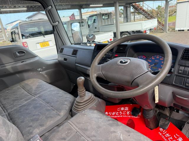 タイタンダッシュ シングルワイドローＤＸ　車検Ｒ８年４月まで　切り替え４ＷＤ　ＭＴ　純正オーディオ　電動格納ミラー　エアコン　パワーステアリング　ＨＩＤヘッドライト　ＥＴＣ車載器　シングルタイヤ　新免許対応車（15枚目）