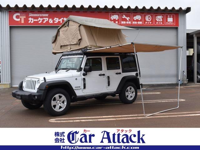 ジープ・ラングラーアンリミテッド スポーツ　４ＷＤ　スミティビルト製ルーフテント　オーニング　バハラックルーフキャリア　ナビＴＶ　バックカメラ　後期モデル　クルーズコントロール　背面タイヤカバー　サイドカメラ　キーレス　ＥＴＣ　ワンオーナー車（2枚目）