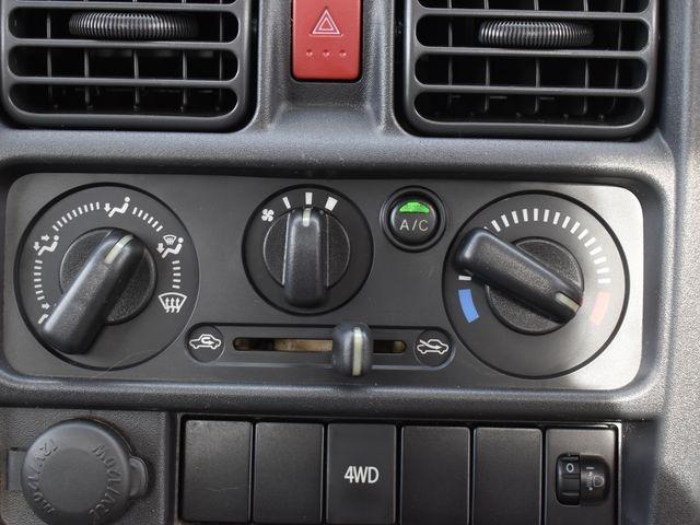 キャリイトラック ＫＣエアコン・パワステ　４ＷＤ　５速マニュアル　左右開閉ホロ　エアコン　パワステ　純正ラジオ　Ｗエアバック　アルミホイール　荷台ゴムマット　荷台プロテクター　車内マット　ドアバイザー（24枚目）