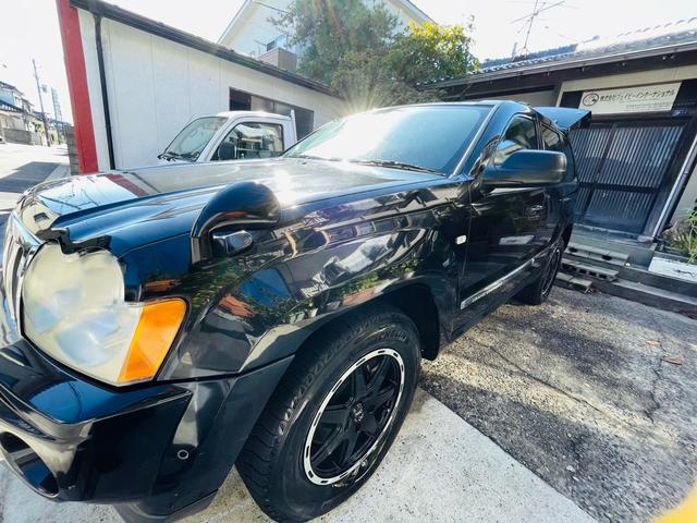 ジープ・グランドチェロキー リミテッド　４ＷＤ、ＨＤＤナビ、バックカメラ、革シート、運転席助手席エアバッグ、パワーシート、シートヒーター、コーナーセンサー、社外アルミ、オートエアコン、キーレスエントリー、走行８７７７６ｋｍ、２年車検整備付き（57枚目）