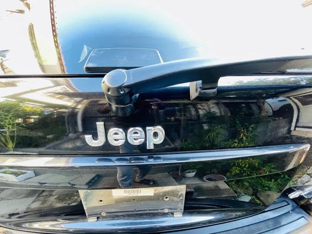 ジープ・グランドチェロキー リミテッド　４ＷＤ、ＨＤＤナビ、バックカメラ、革シート、運転席助手席エアバッグ、パワーシート、シートヒーター、コーナーセンサー、社外アルミ、オートエアコン、キーレスエントリー、走行８７７７６ｋｍ、２年車検整備付き（61枚目）