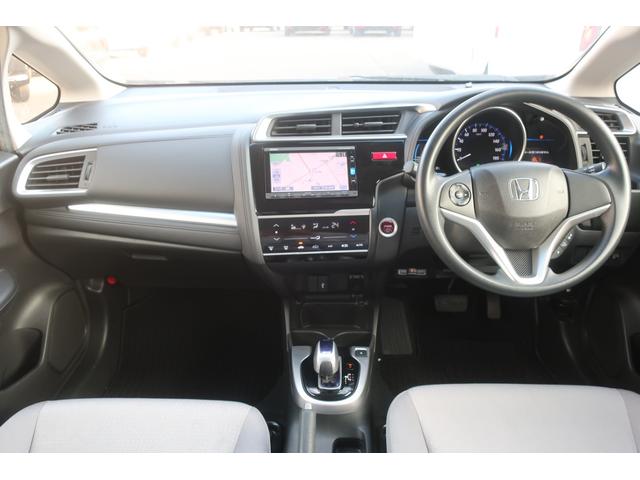 フィットハイブリッド Fパッケージ 禁煙前側ドライブレコーダーメモリーナビフルセグTVバックカメラサイドエアバックオートリトラミラーETC車載器スマートキーフルオートエアコン(2枚目)