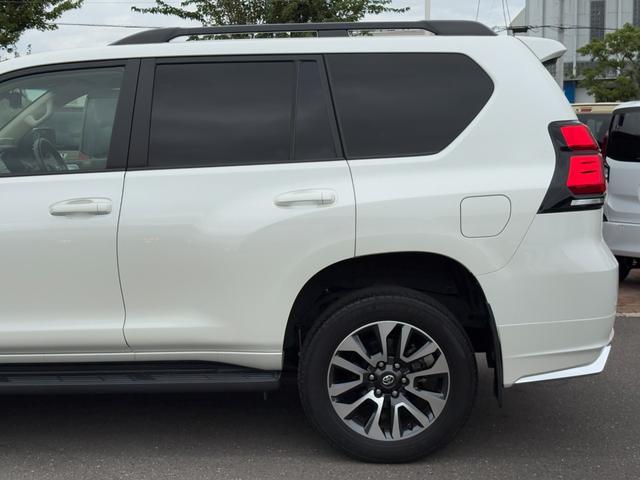 ランドクルーザープラド TX Lパッケージ 買取直販 寒冷地仕様 コムテック前後ドラレコ メーカー装着9型メモリーナビ 本革シート BSM RCTA パノラミックビューモニター 14スピーカー ルーフレール サンルーフ 純正19インチAW(48枚目)