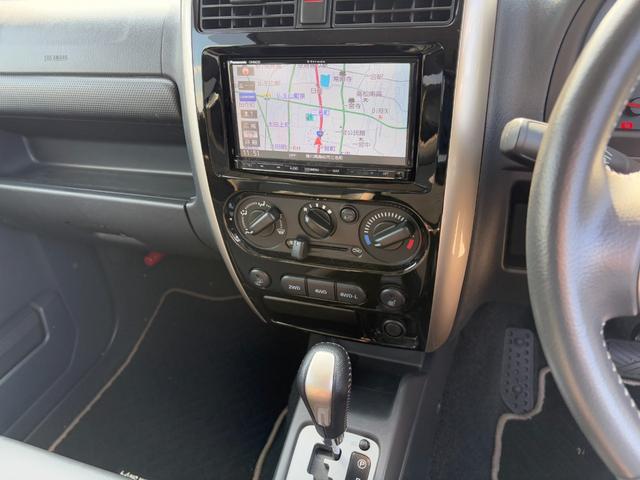 ジムニー ランドベンチャー パナソニックSDナビ フルセグTV バックモニター 革巻きステアリング ハーフレザーシート 運転席シートヒーター ETC車載器 サイドステップ LEDウィンカーミラー 純正16インチAW スペアタイヤ(7枚目)