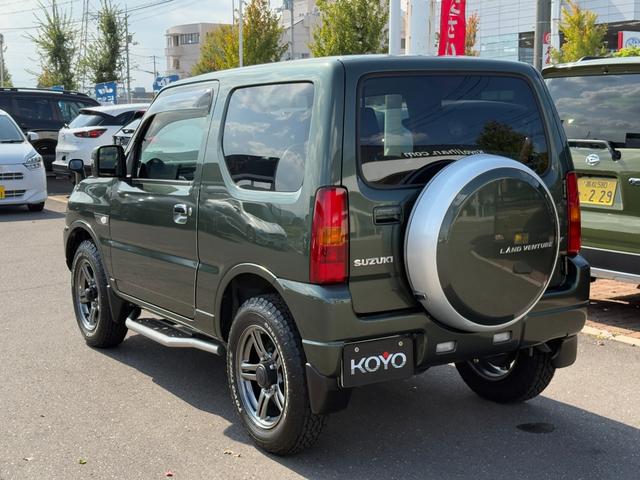 ジムニー ランドベンチャー パナソニックSDナビ フルセグTV バックモニター 革巻きステアリング ハーフレザーシート 運転席シートヒーター ETC車載器 サイドステップ LEDウィンカーミラー 純正16インチAW スペアタイヤ(34枚目)