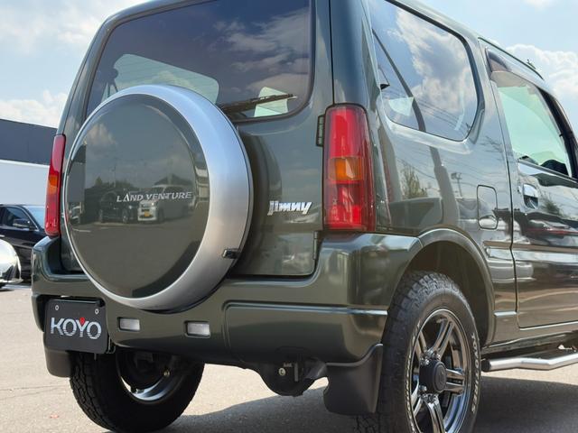 ジムニー ランドベンチャー パナソニックSDナビ フルセグTV バックモニター 革巻きステアリング ハーフレザーシート 運転席シートヒーター ETC車載器 サイドステップ LEDウィンカーミラー 純正16インチAW スペアタイヤ(38枚目)