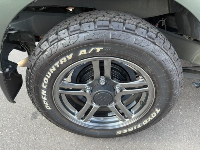 ジムニー ランドベンチャー パナソニックSDナビ フルセグTV バックモニター 革巻きステアリング ハーフレザーシート 運転席シートヒーター ETC車載器 サイドステップ LEDウィンカーミラー 純正16インチAW スペアタイヤ(41枚目)